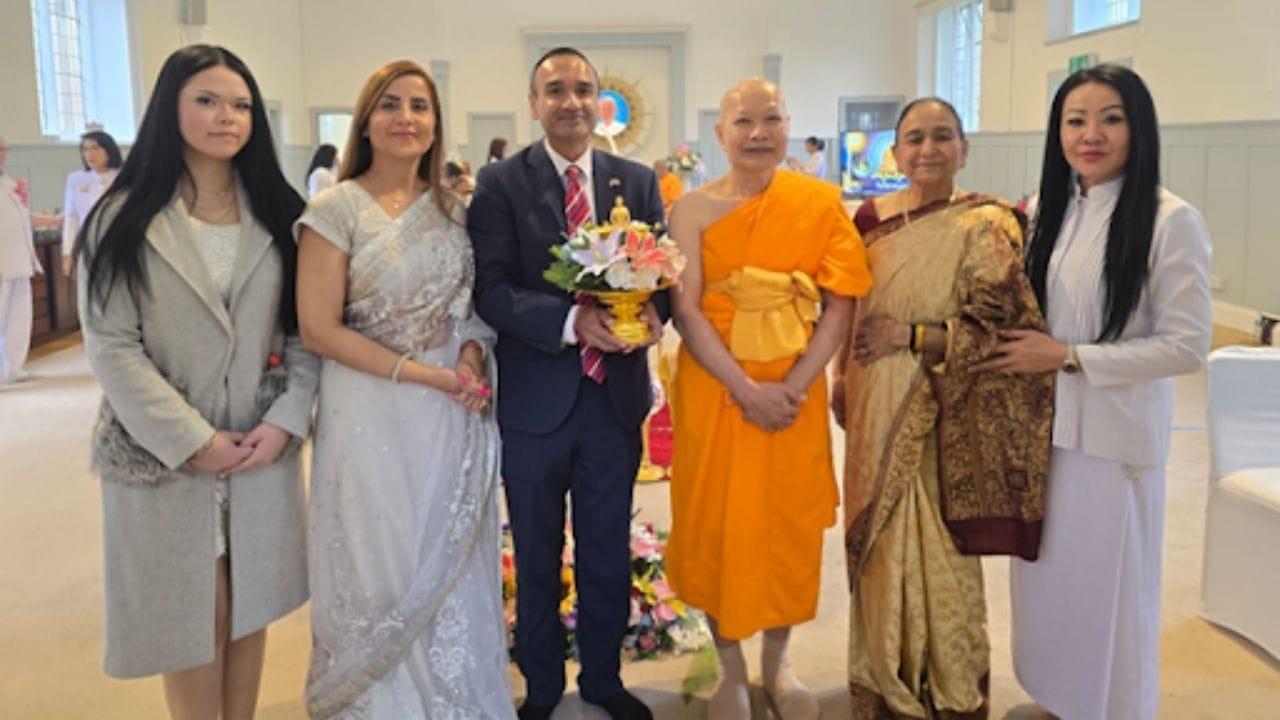 Neil Lal with a Buddhist monk, representing interfaith engagement