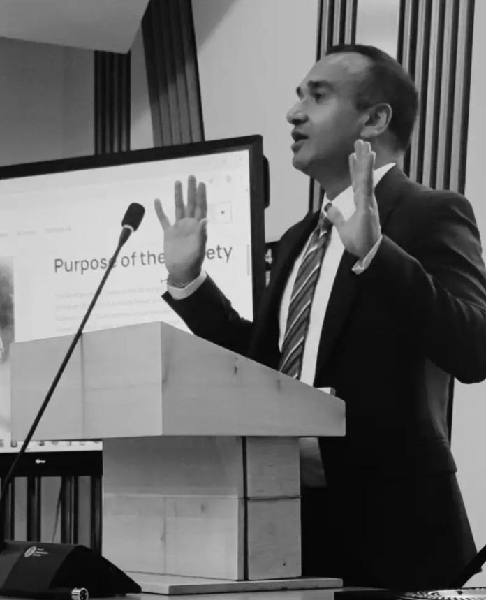 Neil Lal speaking at the Scottish Parliament podium