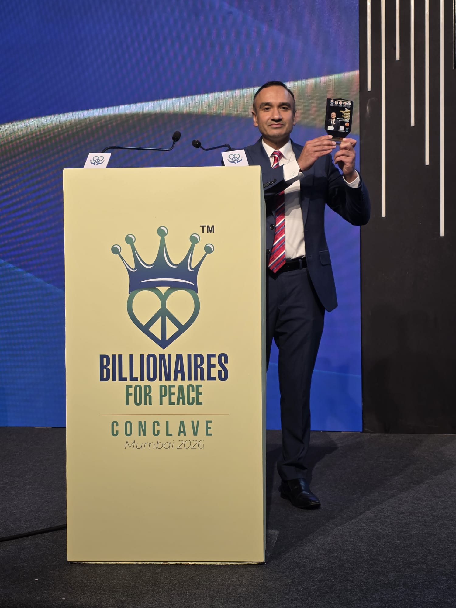 Neil Lal receiving the Champion Award at the Billionaires for Peace Conclave